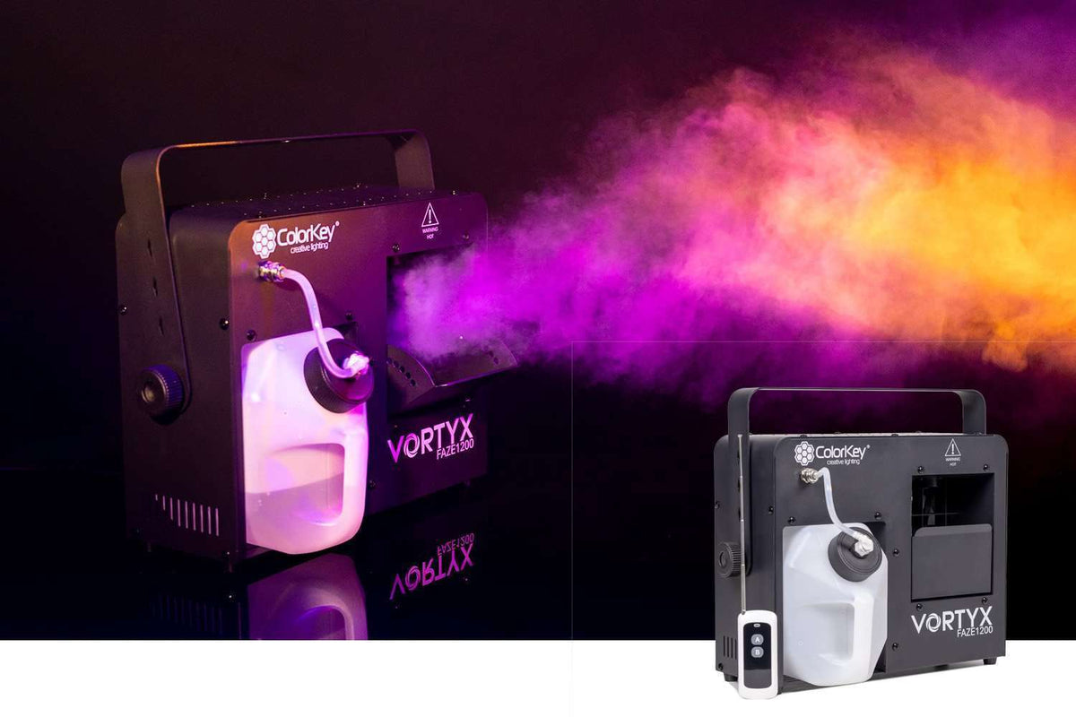 ColorKey Vortyx Faze 1200 producing atmosphere illuminated by purple and yellow lighting